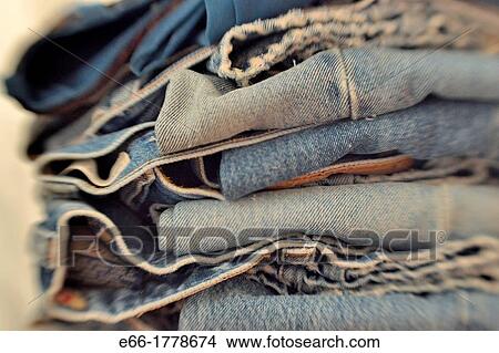 Picture - Stack of folded pairs of blue jeans Shot with LensBaby for selective focus. Fotosearch