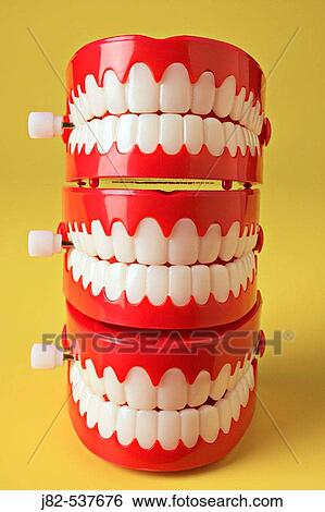 Stack of teeth of three chattering teeth View Large Photo Image Stock Photograph - Stack of teeth of three chattering teeth. Fotosearch