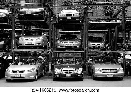 Stacked cars in a parking lot in Manhattan View Large Photo Image Stock Photography - Stacked cars in a parking lot in Manhattan. Fotosearch