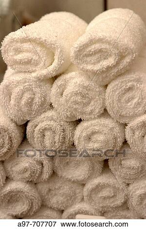 Stacked rolled white towels. View Large Photo Image Stock Photo - Stacked rolled white towels.. Fotosearch