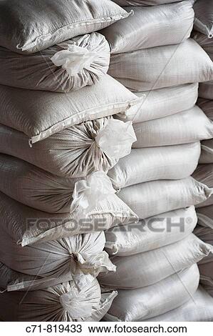 Stacked white construction sand bags View Large Photo Image Stock Image - Stacked white construction sand bags. Fotosearch
