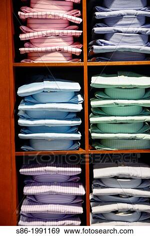 Stock Photo - Stacks of Men's Dress Shirts Displalyed in a Retail Store.. Fotosearch