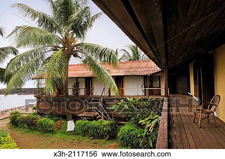 Stock Photograph - staff building of the Pestana Equador hotel on the small Rolas turtledove island in the south of Sao Tome Island, Republic of Sao Tome and Principe, Africa.. Fotosearch