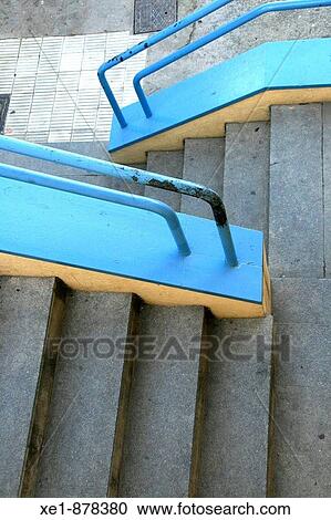 Stock Image - Staircase with blue handrails. Hospitalet del Llobregat, Barcelona province, Catalonia, Spain. Fotosearch