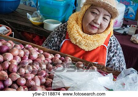 Stallholder at the morning market in Mae Hong Son, Thailand. View Large Photo Image Picture - Stallholder at the morning market in Mae Hong Son, Thailand.. Fotosearch