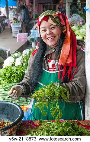 Stallholder at the morning market in Mae Hong Son, Thailand. View Large Photo Image Stock Image - Stallholder at the morning market in Mae Hong Son, Thailand.. Fotosearch