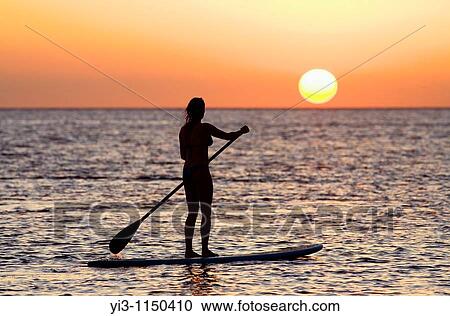 Stand up paddler at sunset at Olowalu, Maui, Hawaii, USA View Large Photo Image Stock Image - Stand up paddler at sunset at Olowalu, Maui, Hawaii, USA. Fotosearch