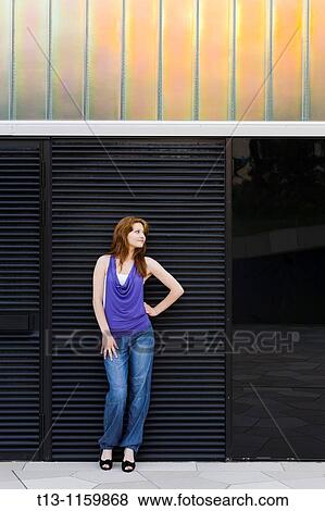 Standing before an industrial building View Large Photo Image Stock Photo - Standing before an industrial building. Fotosearch