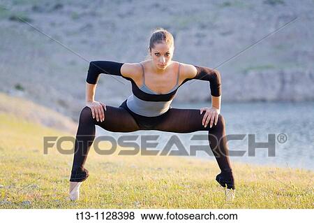 Standing on her tiptoes, attractive ballerina View Large Photo Image Stock Photo - Standing on her tiptoes, attractive ballerina. Fotosearch