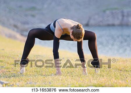 Standing on her tiptoes, attractive ballerina View Large Photo Image Stock Photograph - Standing on her tiptoes, attractive ballerina. Fotosearch