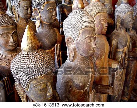 Standing wooden Buddhas at Phsar Thmey, Phnom Penh, Cambodia View Large Photo Image Stock Image - Standing wooden Buddhas at Phsar Thmey, Phnom Penh, Cambodia. Fotosearch