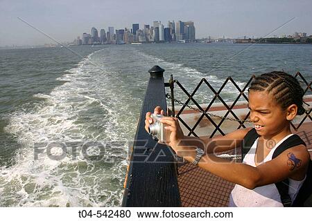 Staten Island Ferry, 10-year-old biracial girl with digital camera. NYC. USA. View Large Photo Image Stock Image - Staten Island Ferry, 10-year-old biracial girl with digital camera. NYC. USA.. Fotosearch