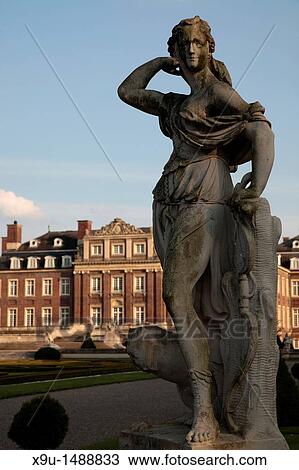 Stock Image - Statue in front of Schloss Nordkirchen Castle, Nordkirchen, Muensterland, North Rhine-Westphalia, Germany, Europe. Fotosearch