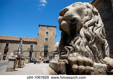 Statue of a stone lion in the square of the Cathedral of Avila, Spain View Large Photo Image Stock Photo - Statue of a stone lion in the square of the Cathedral of Avila, Spain. Fotosearch