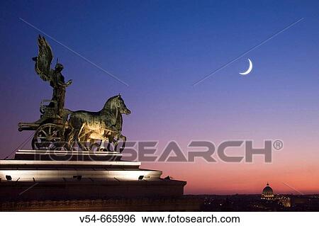 Statue of Goddess Victory, Quadrigas Terrace, Vittorio Emanuele II Monument (Il Vittoriano), Rome, Italy View Large Photo Image Stock Photograph - Statue of Goddess Victory, Quadrigas Terrace, Vittorio Emanuele II Monument (Il Vittoriano), Rome, Italy. Fotosearch