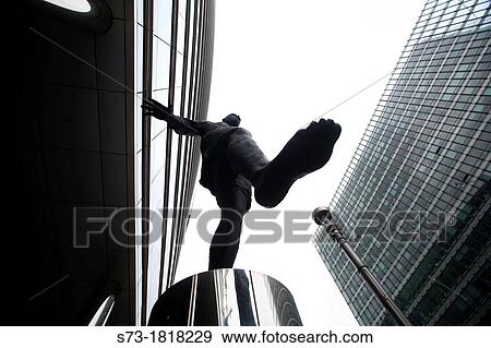 Statue of man walking on air outside the European Commission in Brussels, Belgium View Large Photo Image Stock Photo - Statue of man walking on air outside the European Commission in Brussels, Belgium. Fotosearch