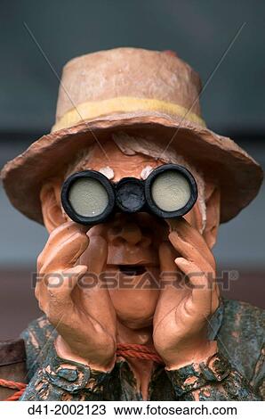 Statue of man with binoculars. View Large Photo Image Stock Image - Statue of man with binoculars.. Fotosearch