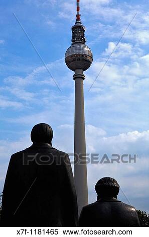 Statue of Marx and Engels in Marx and Engels Platz with Fernsehturm Berlin Germany View Large Photo Image Stock Photography - Statue of Marx and Engels in Marx and Engels Platz with Fernsehturm Berlin Germany. Fotosearch