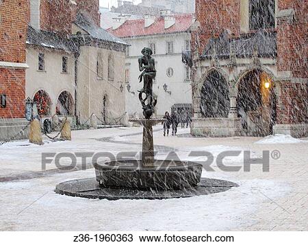 Statue of Student at Mariacki Square, winter, Krakow, Poland. View Large Photo Image Stock Image - Statue of Student at Mariacki Square, winter, Krakow, Poland.. Fotosearch