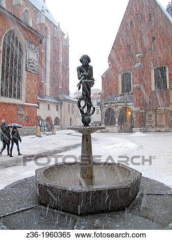 Statue of Student at Mariacki Square, winter, Krakow, Poland. View Large Photo Image Stock Photography - Statue of Student at Mariacki Square, winter, Krakow, Poland.. Fotosearch