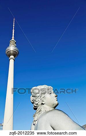 Statue of the Neptun Fountain and TV Tower on Alexanderplatz in Berlin, Germany. View Large Photo Image Stock Photography - Statue of the Neptun Fountain and TV Tower on Alexanderplatz in Berlin, Germany.. Fotosearch