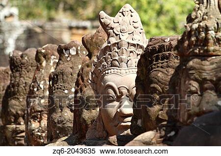 Stock Photography - Statues at the South Gate of Angkor Thom, Cambodia. Fotosearch