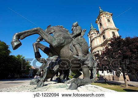 Picture - Statues in Dobo square and the Minorita Church, Eger, Hungary. Fotosearch