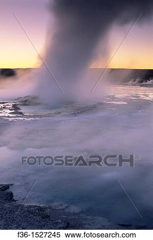 Steam boils out of Fountain Geyser at sunset, Fountain Paint Pot area, Yellowstone National Park, Wyoming View Large Photo Image Stock Photography - Steam boils out of Fountain Geyser at sunset, Fountain Paint Pot area, Yellowstone National Park, Wyoming. Fotosearch