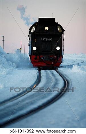 Steam train arriving at top of Brocken mountain in evening, Hochharz National Park, Sachsen-Anhalt, Germany View Large Photo Image Stock Image - Steam train arriving at top of Brocken mountain in evening, Hochharz National Park, Sachsen-Anhalt, Germany. Fotosearch
