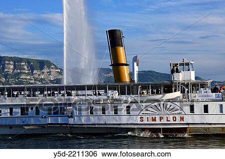 Steamboat on Geneva Lake in Geneva, famous Jet d? Eau fountain in the background, Geneva, Switerland View Large Photo Image Stock Photograph - Steamboat on Geneva Lake in Geneva, famous Jet d? Eau fountain in the background, Geneva, Switerland. Fotosearch