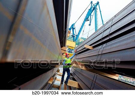 Picture - Steel Girders, Siderurgical products, Pasajes Port, Gipuzkoa, Basque Country, Spain.. Fotosearch