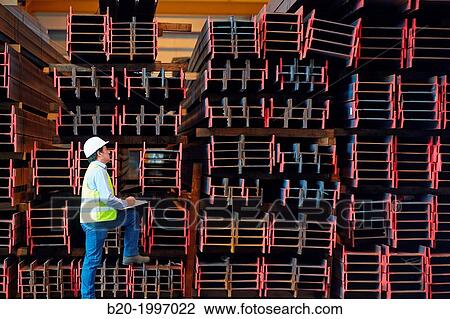 Stock Image - Steel Girders, Siderurgical products, Port warehouse, Pasajes Port, Gipuzkoa, Basque Country, Spain.. Fotosearch