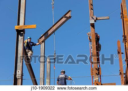 Steel workers assemble building framework girders, Boston, MA View Large Photo Image Stock Image - Steel workers assemble building framework girders, Boston, MA. Fotosearch