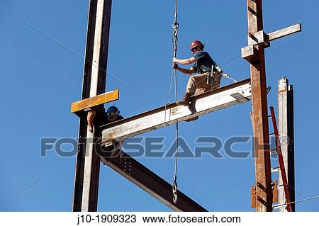 Steel workers assemble building framework girders, Boston, MA View Large Photo Image Stock Image - Steel workers assemble building framework girders, Boston, MA. Fotosearch