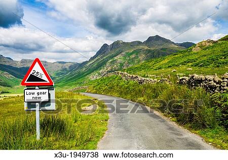 Steep hill warning sign on the roadside overlooking Langdale Fell in the Lake District, Cumbria, England. View Large Photo Image Stock Photo - Steep hill warning sign on the roadside overlooking Langdale Fell in the Lake District, Cumbria, England.. Fotosearch
