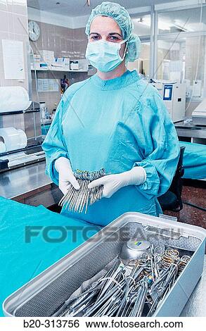 Stock Photograph - Sterilization works at surgery division of hospital. Fotosearch