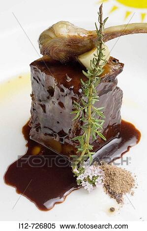 Stewed veal ham with mencia sauce and artichokes at restaurant A Rexidora by Javier Gonzalez, Bentraces. Orense province, Galicia, Spain View Large Photo Image Stock Photography - Stewed veal ham with mencia sauce and artichokes at restaurant A Rexidora by Javier Gonzalez, Bentraces. Orense province, Galicia, Spain. Fotosearch