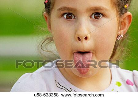 Sticking out tongue. View Large Photo Image Stock Photo - Sticking out tongue.. Fotosearch