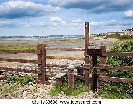 Stock Photo - Stile along the South West Coast Path by the Taw and Torridge Estuary at Appledore, Devon, England, United Kingdom. Fotosearch