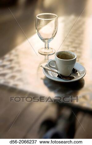 Stock Photo - Still life of a cup of coffee on a table, Valencia, Spain. Fotosearch