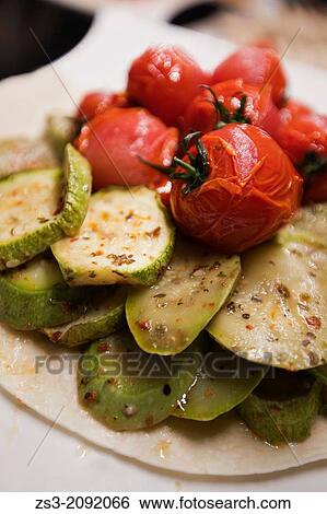 Stock Photograph - Still-life photo of grilled tomatoes and grilled zucchini, Istanbul, Marmara Province, Turkey, Europe.. Fotosearch