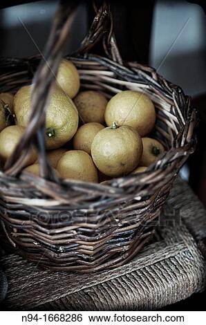 Still life with lemons basket of bulrushes on the chair in the kitchen View Large Photo Image Stock Photograph - Still life with lemons basket of bulrushes on the chair in the kitchen. Fotosearch