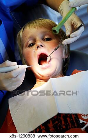 Stock photo of a 10 year old boy sitting in the Dentists chair View Large Photo Image Stock Photo - Stock photo of a 10 year old boy sitting in the Dentists chair. Fotosearch