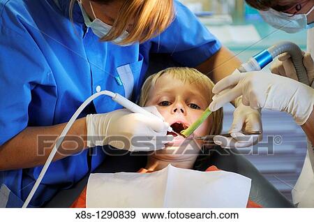Stock photo of a 10 year old boy sitting in the Dentists chair View Large Photo Image Stock Photo - Stock photo of a 10 year old boy sitting in the Dentists chair. Fotosearch