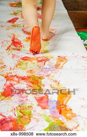 Stock photo of a 3 year old girl enjoying some creative play with feet paints View Large Photo Image Stock Photo - Stock photo of a 3 year old girl enjoying some creative play with feet paints. Fotosearch