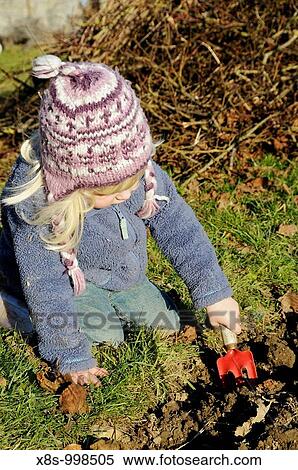 Stock photo of a 3 year old girl helping in the garden View Large Photo Image Stock Photography - Stock photo of a 3 year old girl helping in the garden. Fotosearch