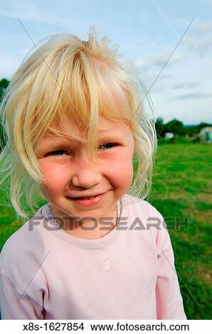 Stock photo of a 6 year old girl outside in the garden View Large Photo Image Picture - Stock photo of a 6 year old girl outside in the garden. Fotosearch