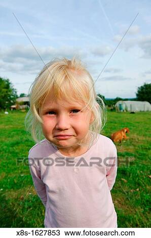 Stock photo of a 6 year old girl outside in the garden View Large Photo Image Stock Image - Stock photo of a 6 year old girl outside in the garden. Fotosearch