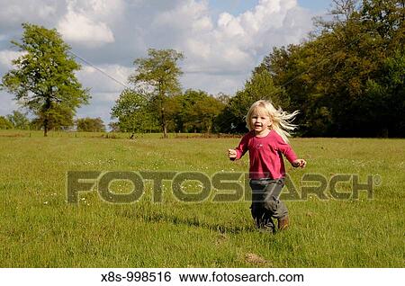 Stock photo of a blond haired 3 year old girl running in a field View Large Photo Image Stock Photograph - Stock photo of a blond haired 3 year old girl running in a field. Fotosearch
