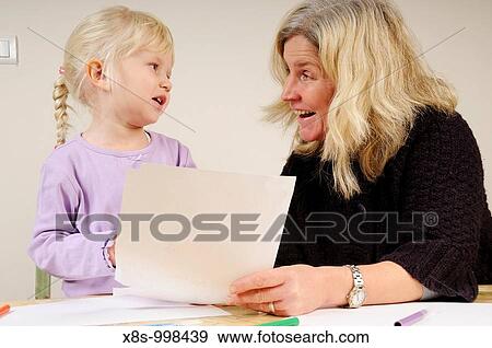 Stock photo of a four year old girl and her mother sitting at a table drawing pictures View Large Photo Image Stock Photo - Stock photo of a four year old girl and her mother sitting at a table drawing pictures. Fotosearch